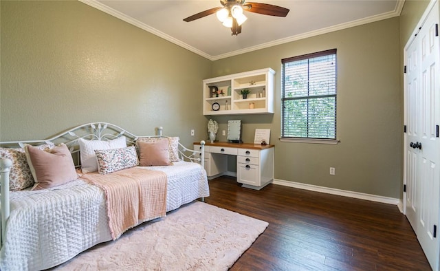 bedroom featuring ceiling fan, dark hardwood / wood-style floors, crown molding, and a closet