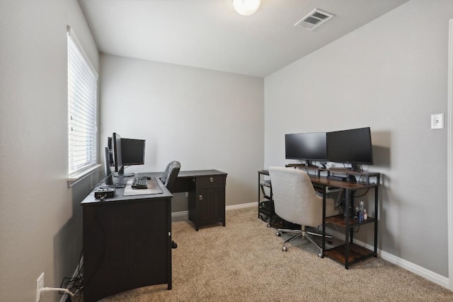 carpeted office space with a healthy amount of sunlight