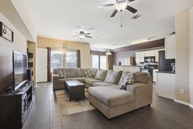 living room featuring ceiling fan