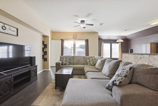 living room featuring dark hardwood / wood-style floors and ceiling fan