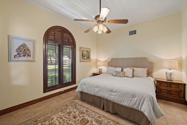 bedroom featuring ceiling fan and crown molding