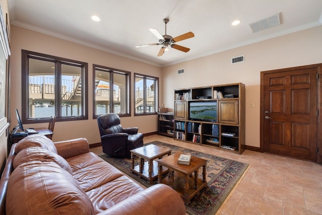 living room featuring ceiling fan and ornamental molding