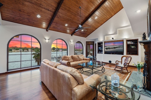 living room featuring beam ceiling, ceiling fan, high vaulted ceiling, wood-type flooring, and wood ceiling