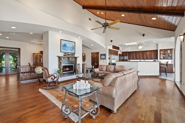 living room with wood-type flooring, beamed ceiling, wood ceiling, and high vaulted ceiling