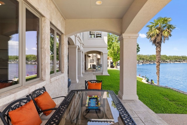 view of patio / terrace with a water view