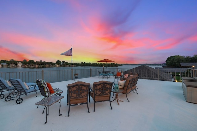 patio terrace at dusk with a water view