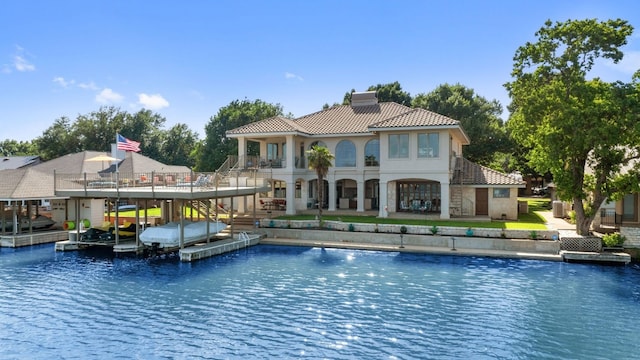 view of swimming pool with a boat dock and a water view