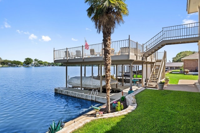 view of dock featuring a water view and a yard