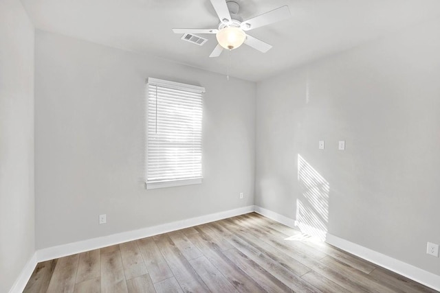 spare room featuring ceiling fan and light hardwood / wood-style floors