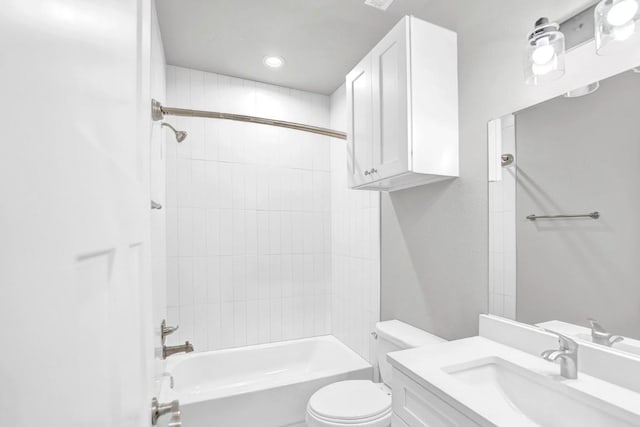 full bathroom featuring toilet, vanity, and tiled shower / bath combo