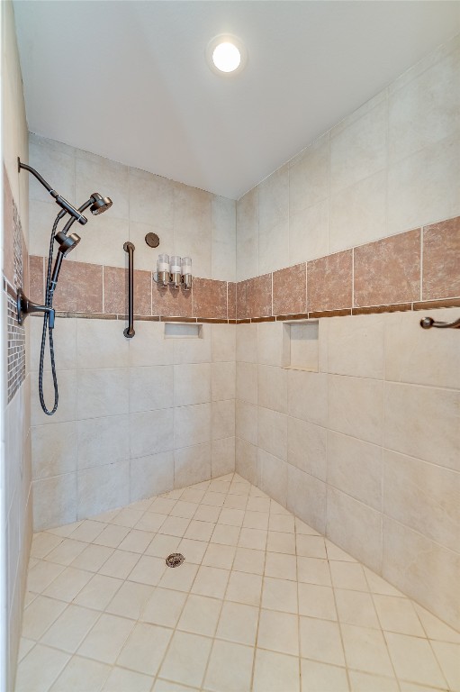 bathroom with tiled shower