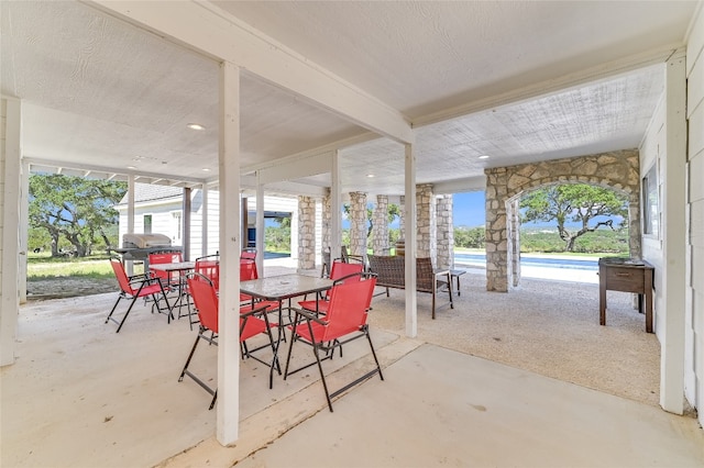 view of patio with an outdoor living space, a pool, and grilling area