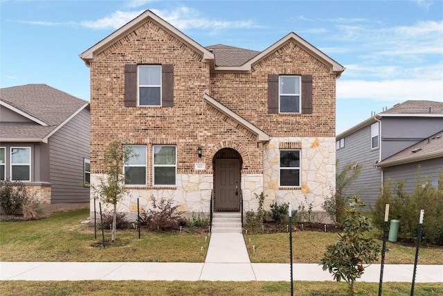 view of front of property with a front lawn