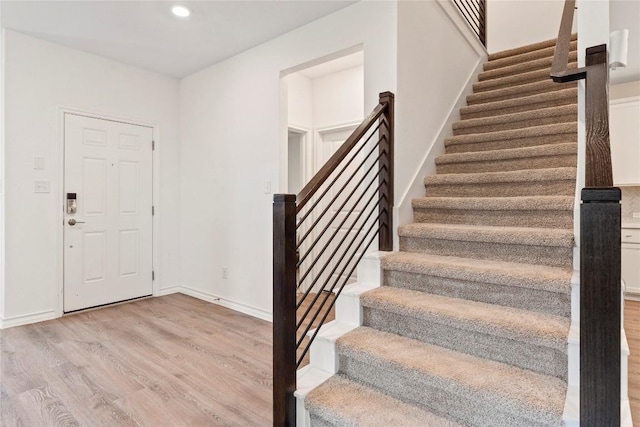 foyer with light hardwood / wood-style flooring