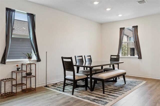 dining room with plenty of natural light and light wood-type flooring