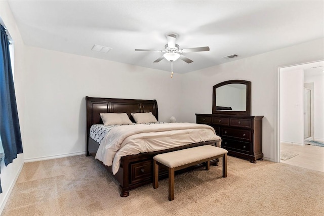 bedroom with ceiling fan and light colored carpet