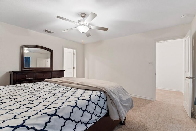 bedroom with light carpet and ceiling fan