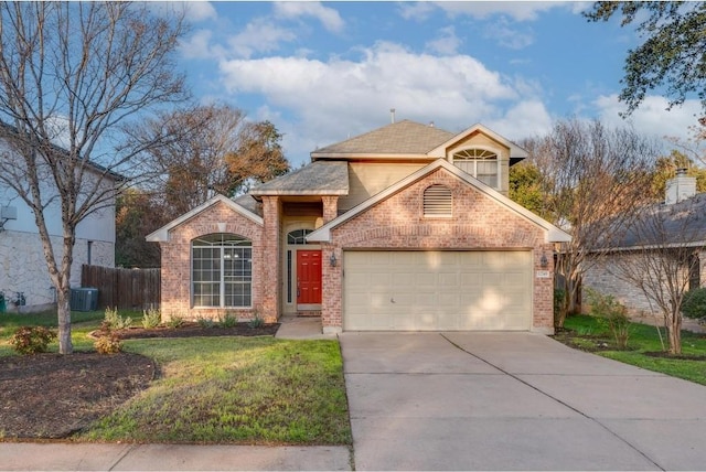 view of property with central air condition unit, a front yard, and a garage