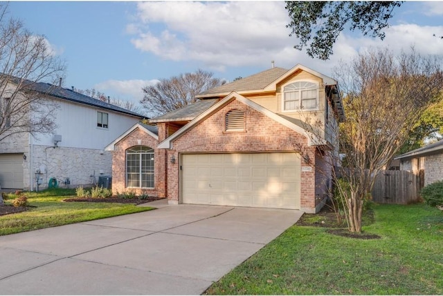 front facade featuring a garage and a front lawn