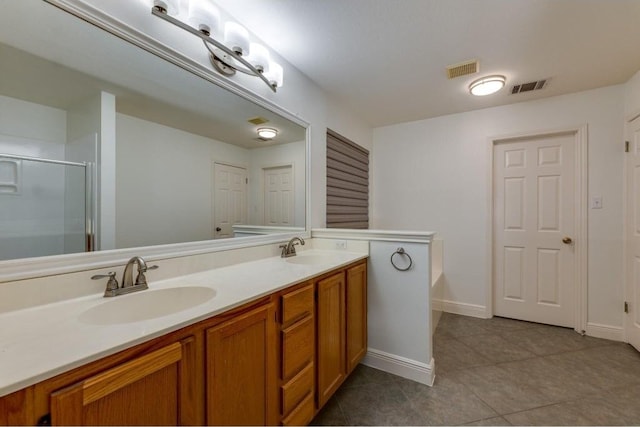 bathroom featuring tile patterned flooring, vanity, and independent shower and bath