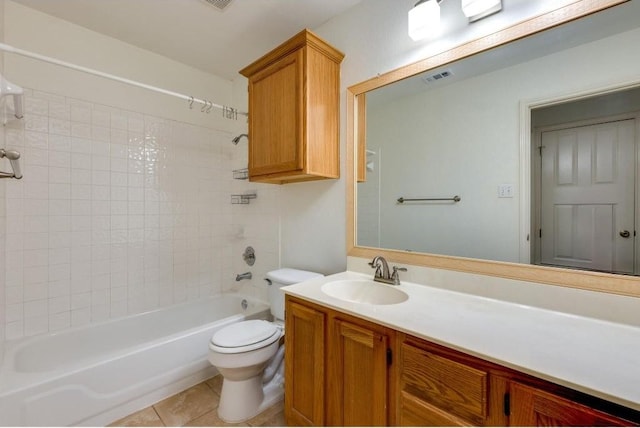 full bathroom featuring tile patterned flooring, vanity,  shower combination, and toilet