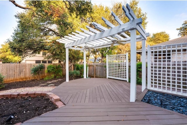 wooden deck featuring a pergola and ceiling fan