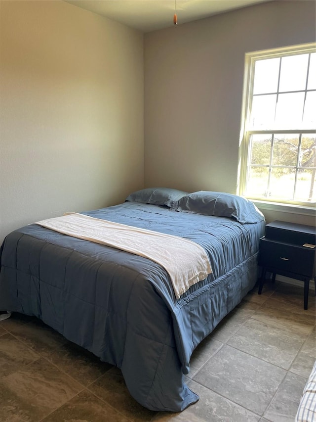 bedroom with multiple windows