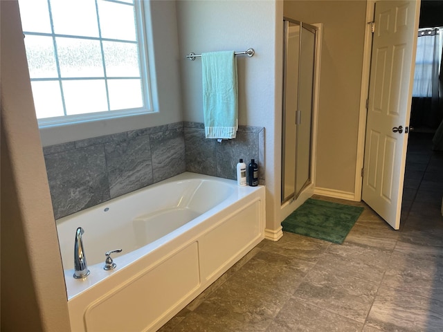 bathroom with shower with separate bathtub