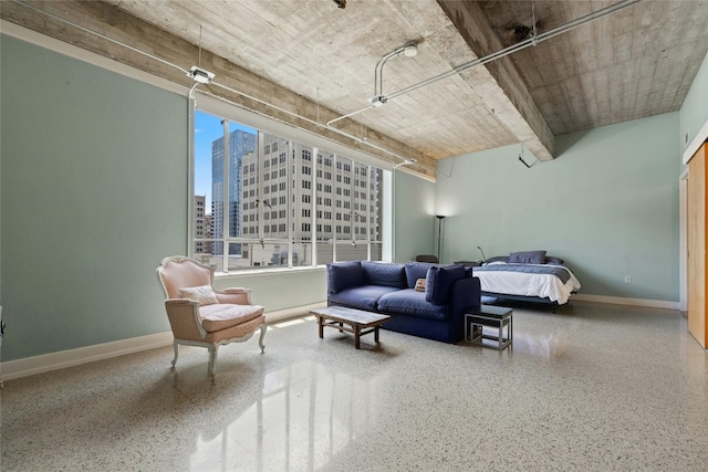 710 Colorado St Unit 5F, Austin, TX 78701 - bedroom featuring speckle patterned floor, baseboards, and a view of city