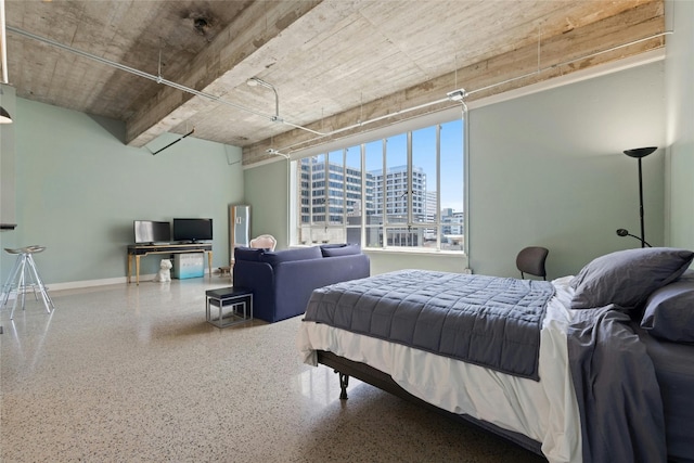 710 Colorado St Unit 5F, Austin, TX 78701 - bedroom featuring speckle patterned floor and baseboards