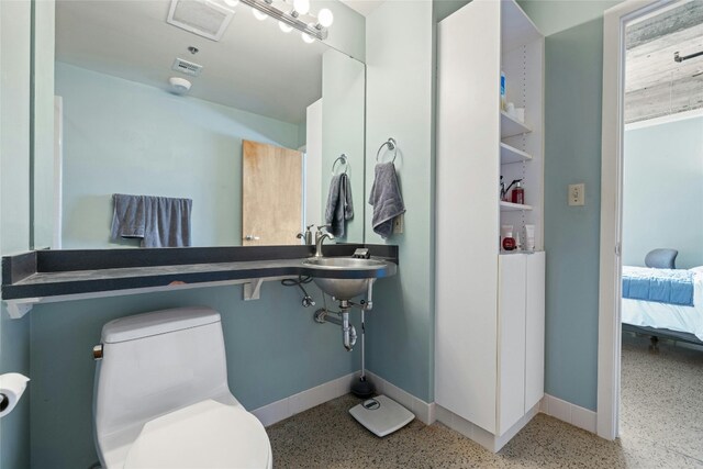 bathroom with toilet and sink