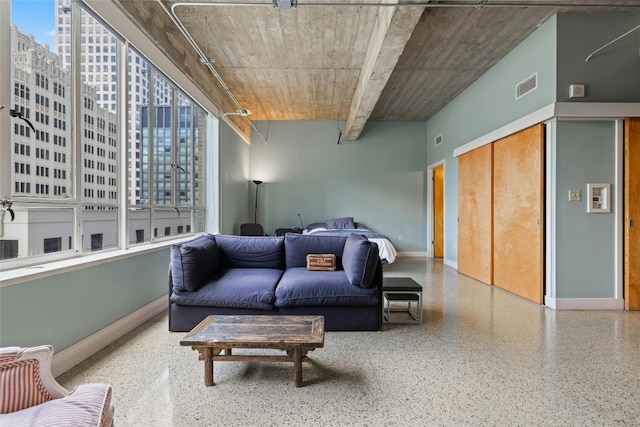 710 Colorado St Unit 5F, Austin, TX 78701 - living area with speckled floor, baseboards, and a city view