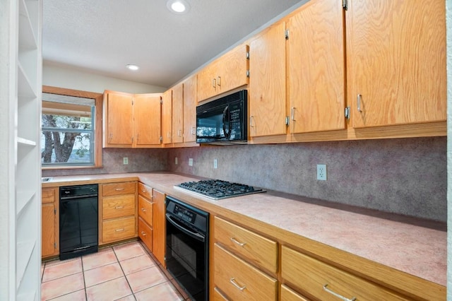 kitchen with black appliances, light tile patterned floors, and backsplash