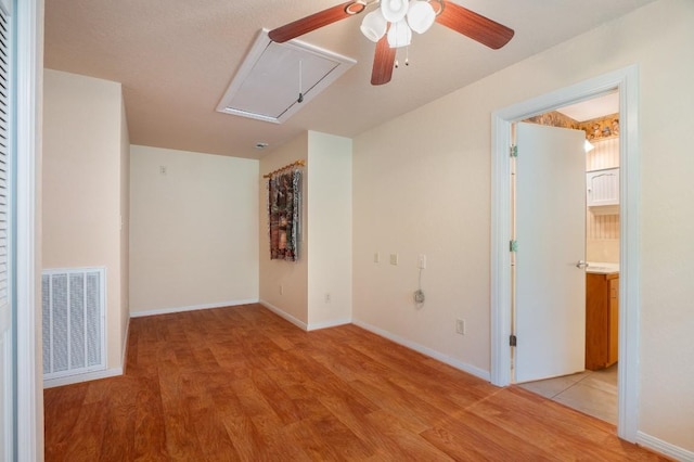 spare room with ceiling fan and light hardwood / wood-style floors