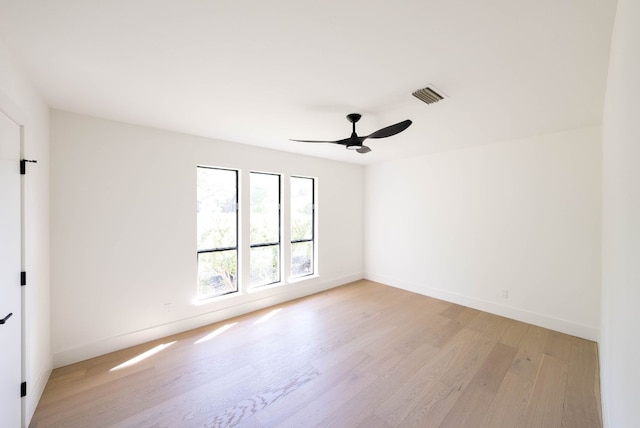 empty room featuring ceiling fan and light wood-type flooring