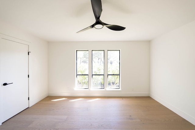 unfurnished room featuring a healthy amount of sunlight and light hardwood / wood-style floors