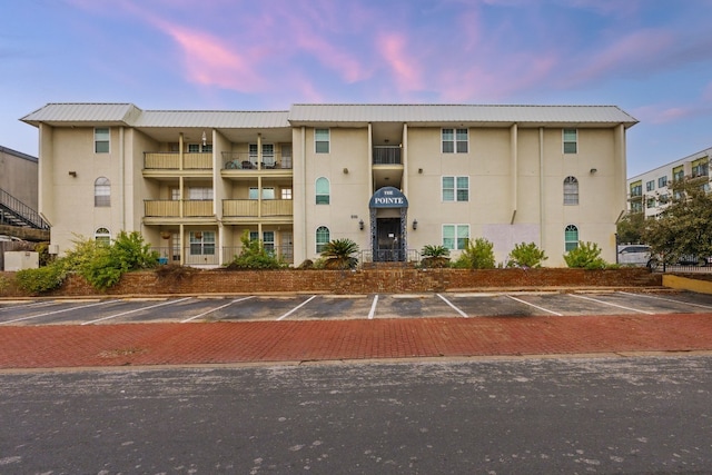 view of outdoor building at dusk