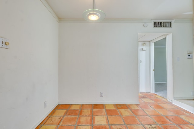 spare room with crown molding