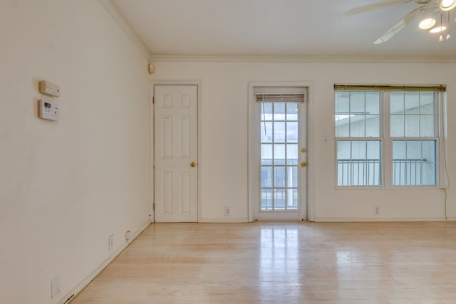 unfurnished room featuring ceiling fan, light hardwood / wood-style floors, and crown molding