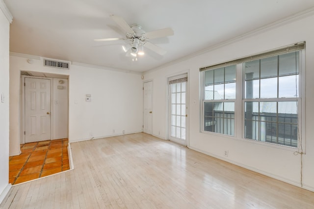 910 Duncan Ln Unit 50, Austin, TX 78705 - spare room featuring ornamental molding, ceiling fan, and wood finished floors