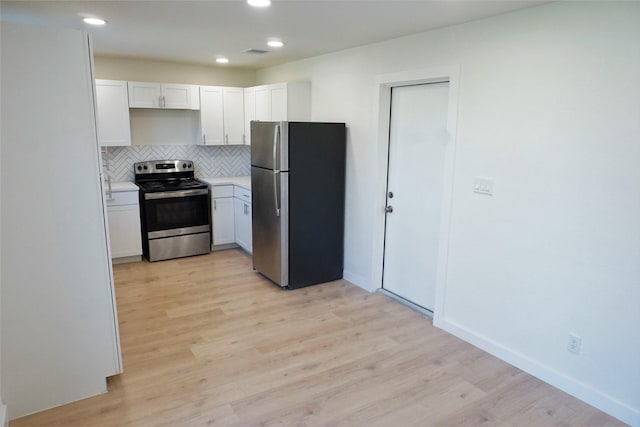 kitchen featuring tasteful backsplash, light hardwood / wood-style flooring, stainless steel appliances, and white cabinets