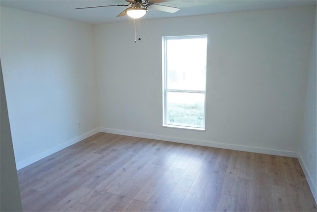 spare room with ceiling fan and light hardwood / wood-style flooring