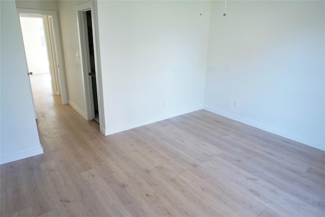 unfurnished room featuring light hardwood / wood-style floors