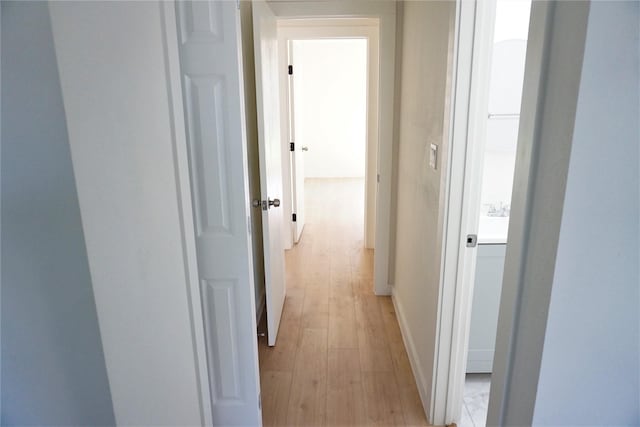 hallway featuring light hardwood / wood-style flooring