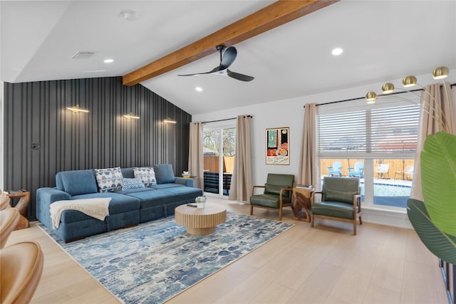 living room featuring vaulted ceiling with beams, ceiling fan, and light hardwood / wood-style floors