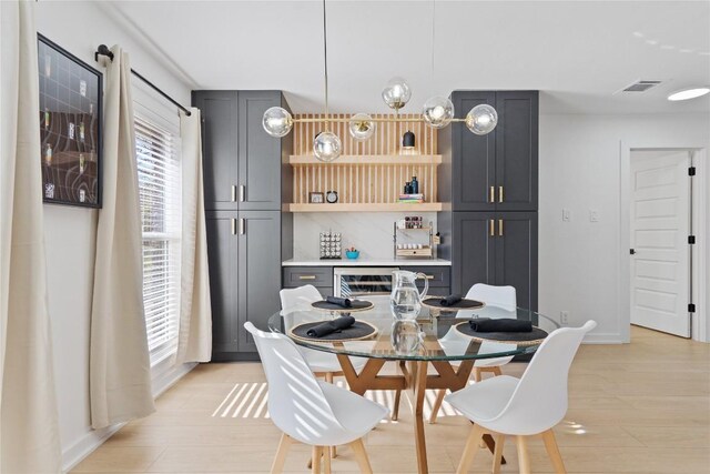 dining space featuring light wood-type flooring