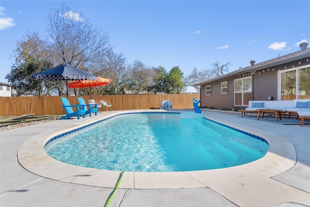 view of swimming pool with a patio