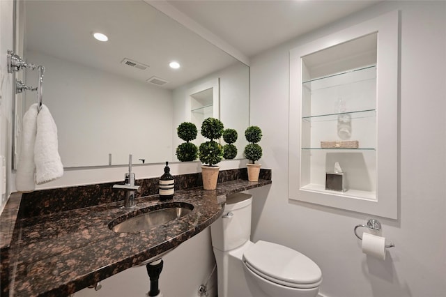 bathroom featuring toilet and sink