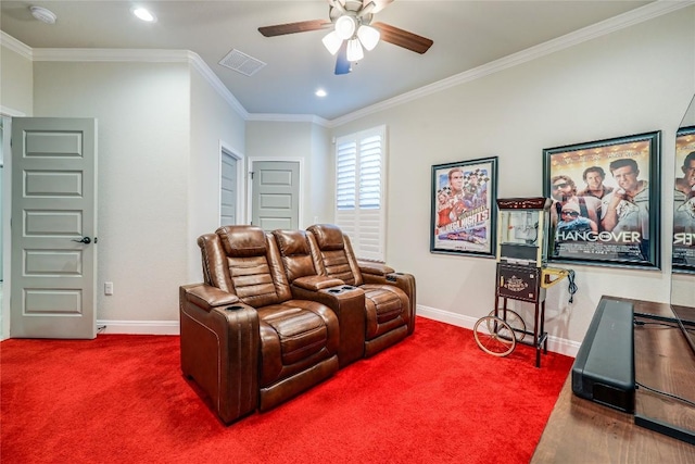 cinema with carpet floors, baseboards, visible vents, and ornamental molding