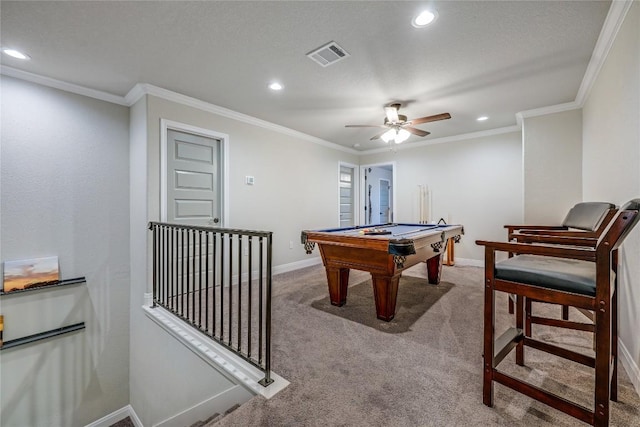 recreation room featuring carpet floors, recessed lighting, visible vents, ornamental molding, and baseboards